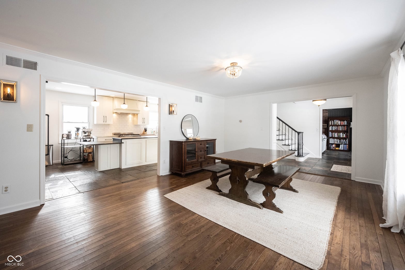 Spacious open-concept dining with hardwood floors and modern finishes.