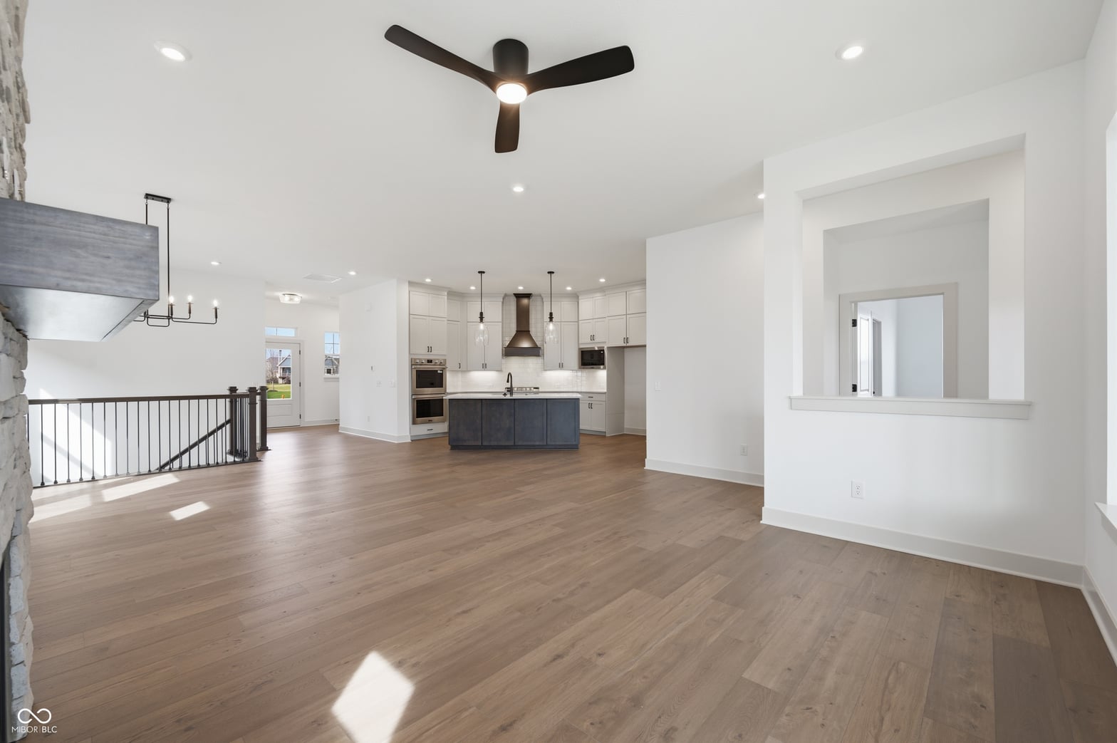 Bright open-concept kitchen and family room with modern finishes.