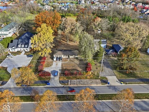 Aerial view at 1836 W Main Street, Carmel, IN — Spacious lot with mature trees in established neighborhood.