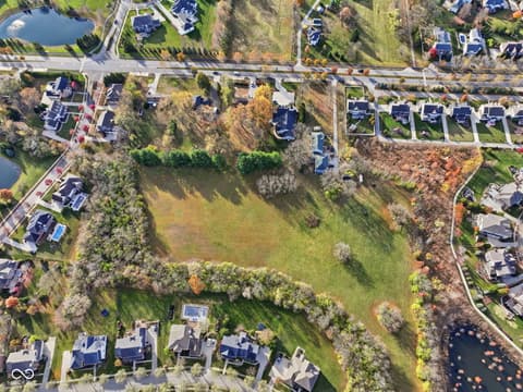 Aerial view at 1836 W Main Street, Carmel, IN — Expansive lot in established neighborhood with mature trees.