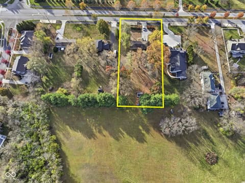 Aerial view at 1836 W Main Street, Carmel, IN — Spacious waterfront lot with mature trees and privacy.