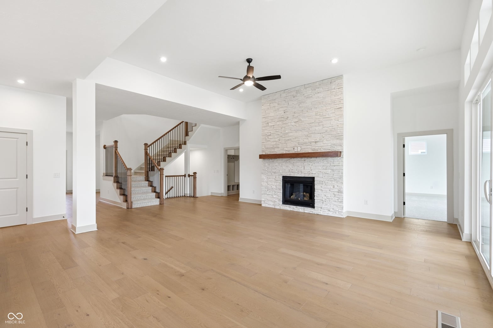 Stunning open-concept living with fireplace and hardwoods.