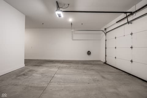 Garage at 705 Livingstone Drive, Carmel, IN — Bright, clean garage with modern LED lighting.