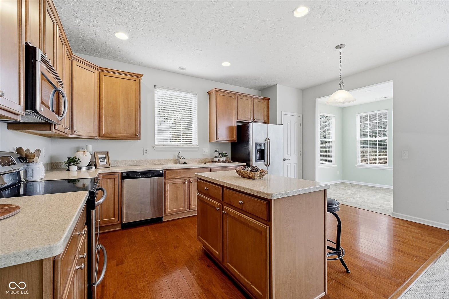 Bright updated kitchen with quality finishes and island.