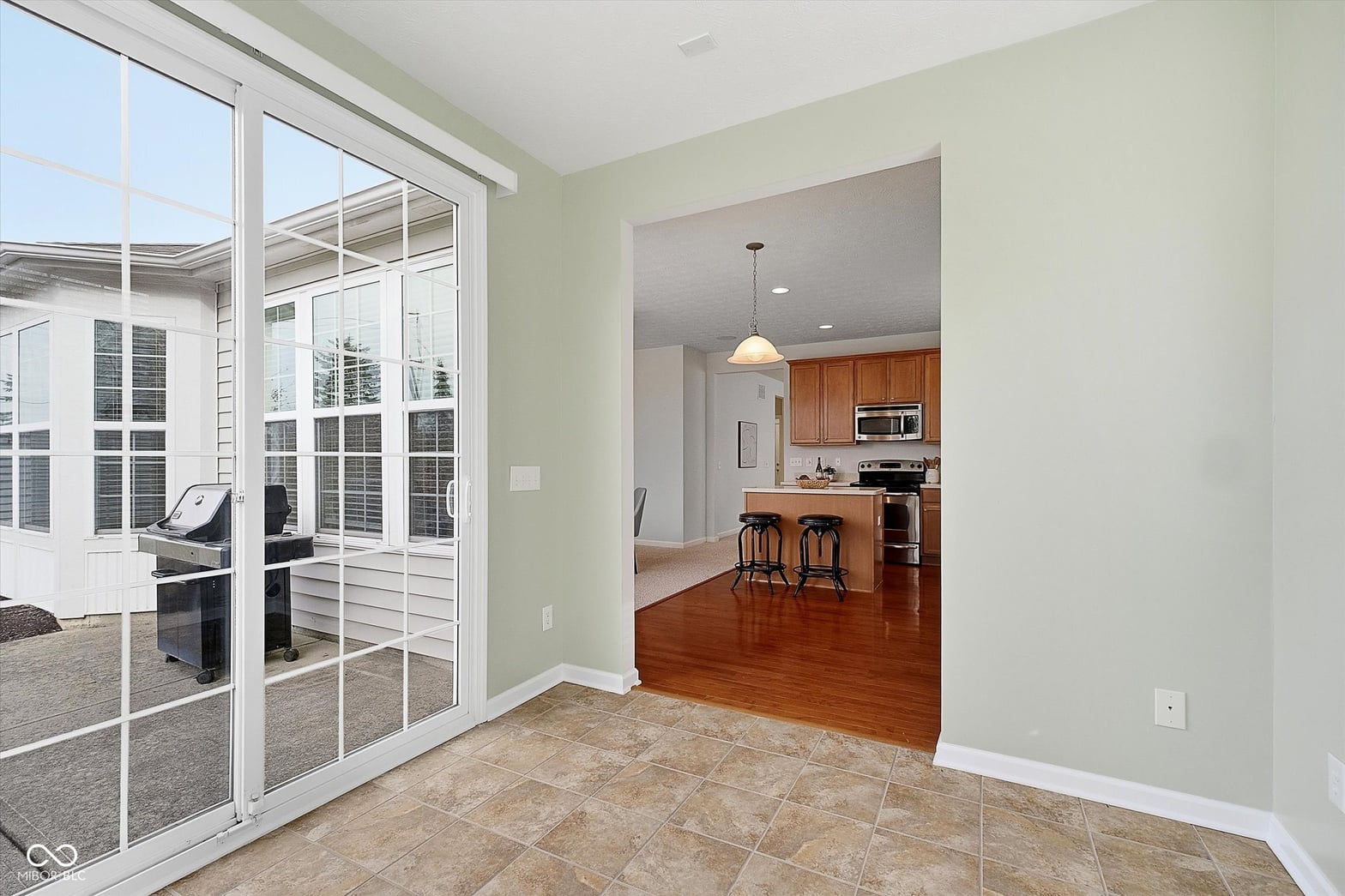 Bright open-concept family room with patio access.