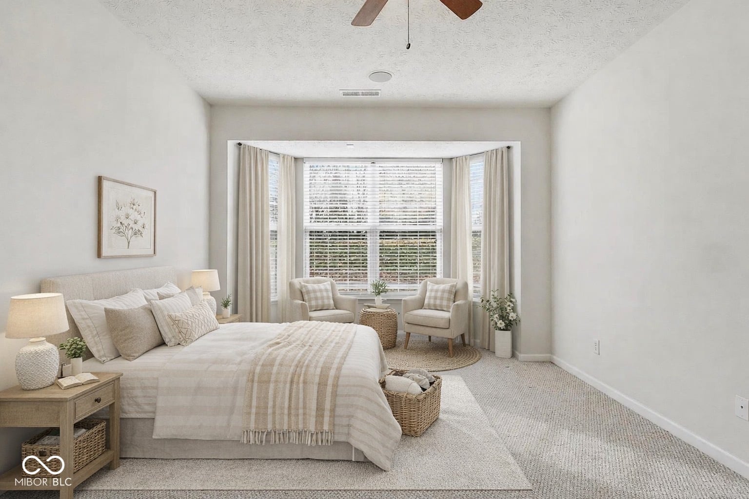 Bright primary bedroom with bay window and seating nook.