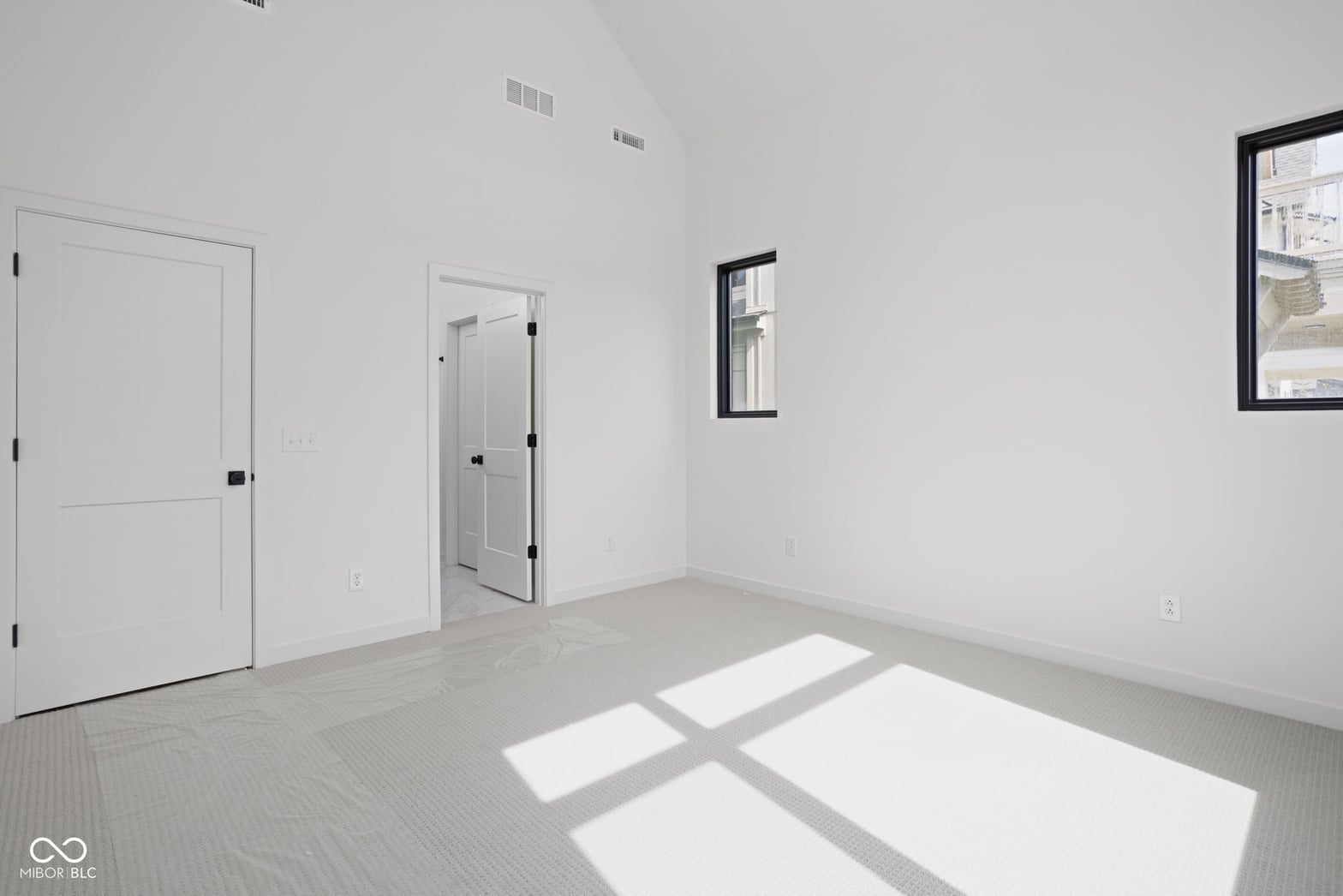 Bright, modern primary suite with ensuite bath and closet.