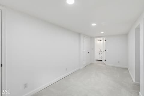 Primary bedroom at 4991 E Main Street, Carmel, IN — Spacious primary suite with ensuite bath and walk-in closet.
