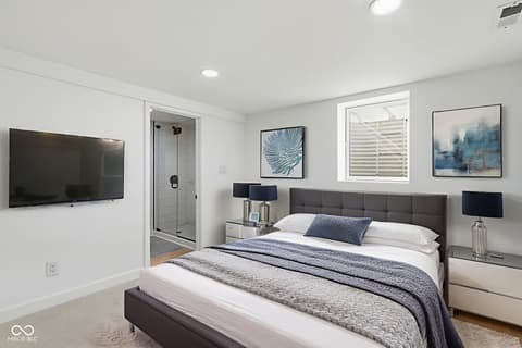 Primary bedroom at 4991 E Main Street, Carmel, IN — Luxury primary suite with spa-like en-suite bathroom.