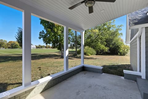 Outdoor living area at 4991 E Main Street, Carmel, IN — Spacious covered patio with stunning open yard views.