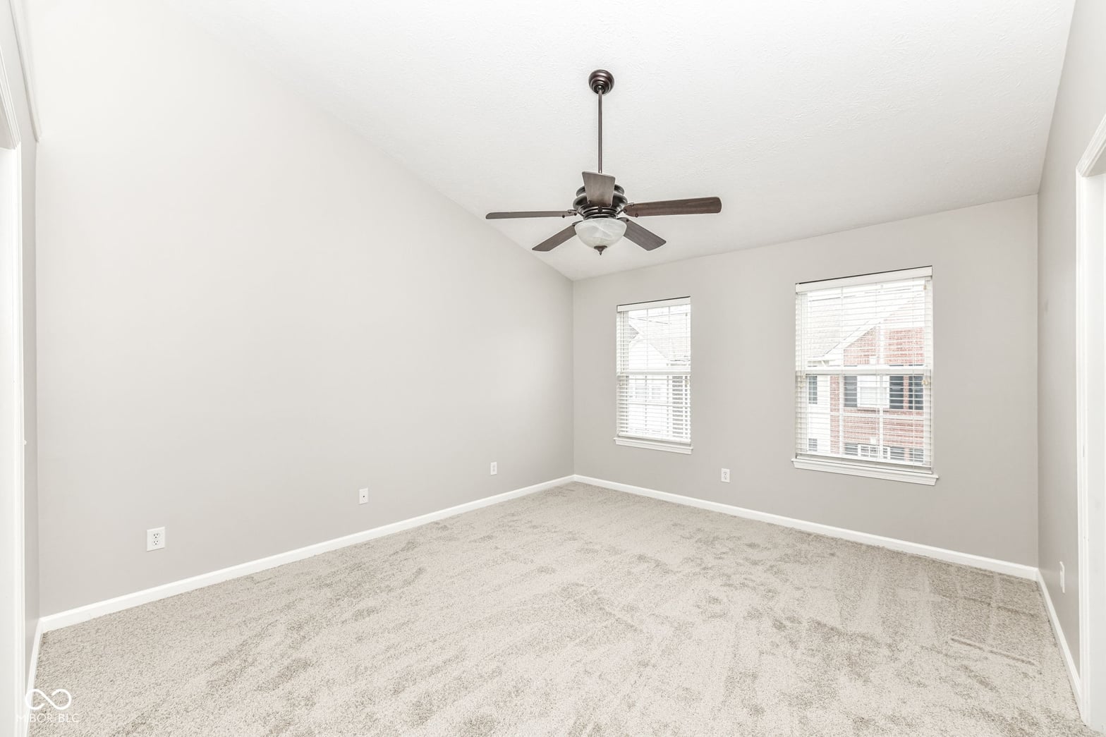 Bright bedroom with excellent natural light and new finishes.
