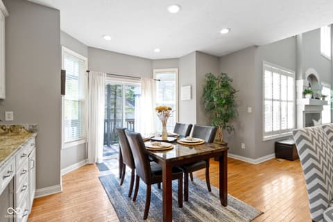 Dining room at 14825 Latitude Way, Fishers, IN — Bright dining area with deck access and modern finishes.
