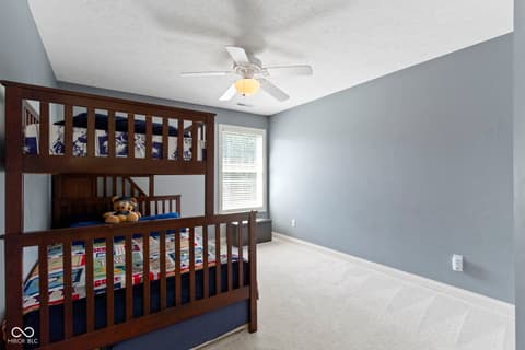 Bedroom at 14825 Latitude Way, Fishers, IN — Built-in loft bed with ample storage and natural light.