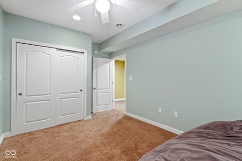 Primary bedroom at 14825 Latitude Way, Fishers, IN — Spacious primary bedroom with dual closets and fresh paint.
