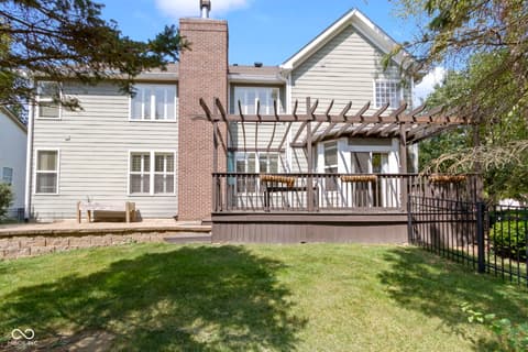 Backyard at 14825 Latitude Way, Fishers, IN — Spacious deck and pergola perfect for outdoor entertaining.