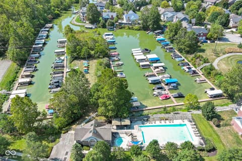 Aerial view at 14825 Latitude Way, Fishers, IN — Waterfront marina community with pool and boat access.