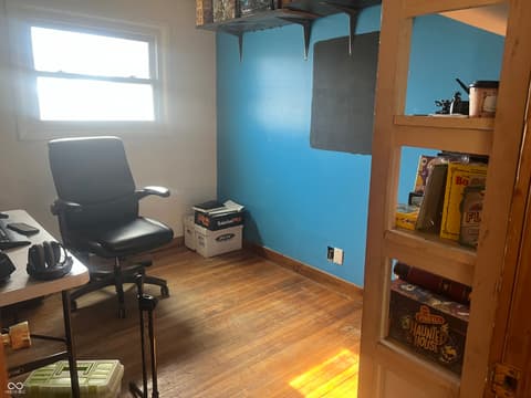 Home office at 6160 E 116th Street, Fishers, IN — Spacious office with hardwood floors and built-in storage.