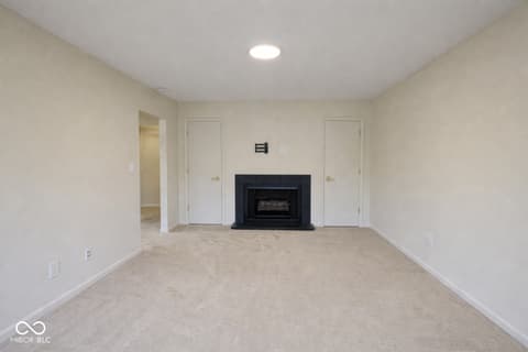 Family room at 586 Hunters Drive, Carmel, IN — Spacious family room with fireplace and modern finishes.