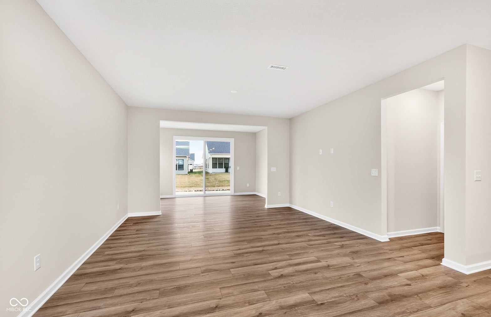 Bright open living space with modern hardwood floors.