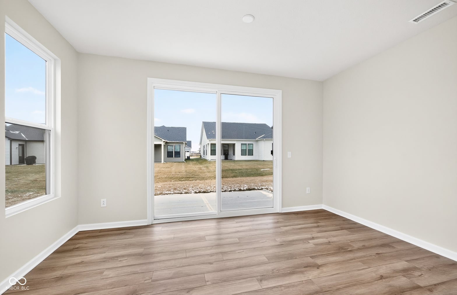 Bright, spacious room with direct outdoor access and views.