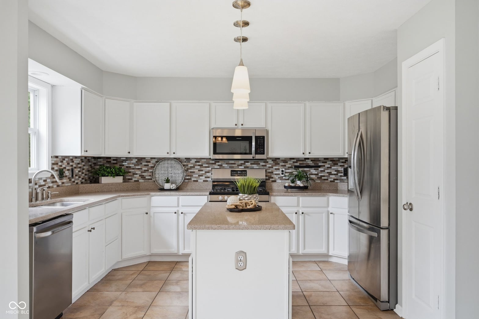 Bright updated kitchen with island and modern amenities.