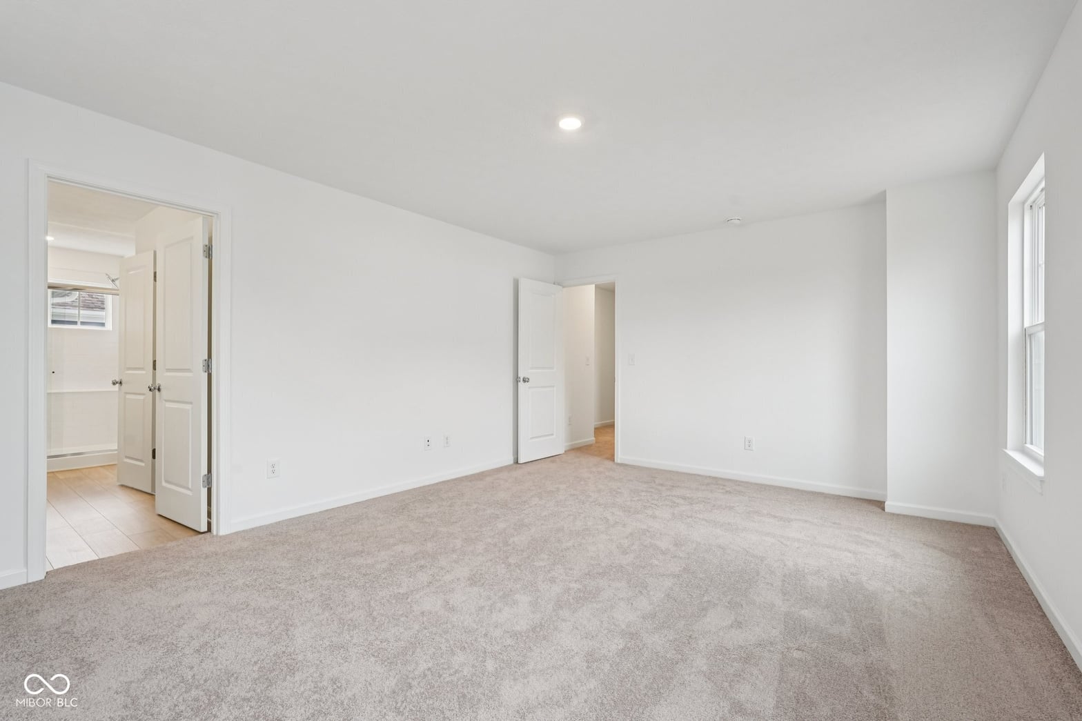 Spacious primary bedroom with ensuite and walk-in closet.