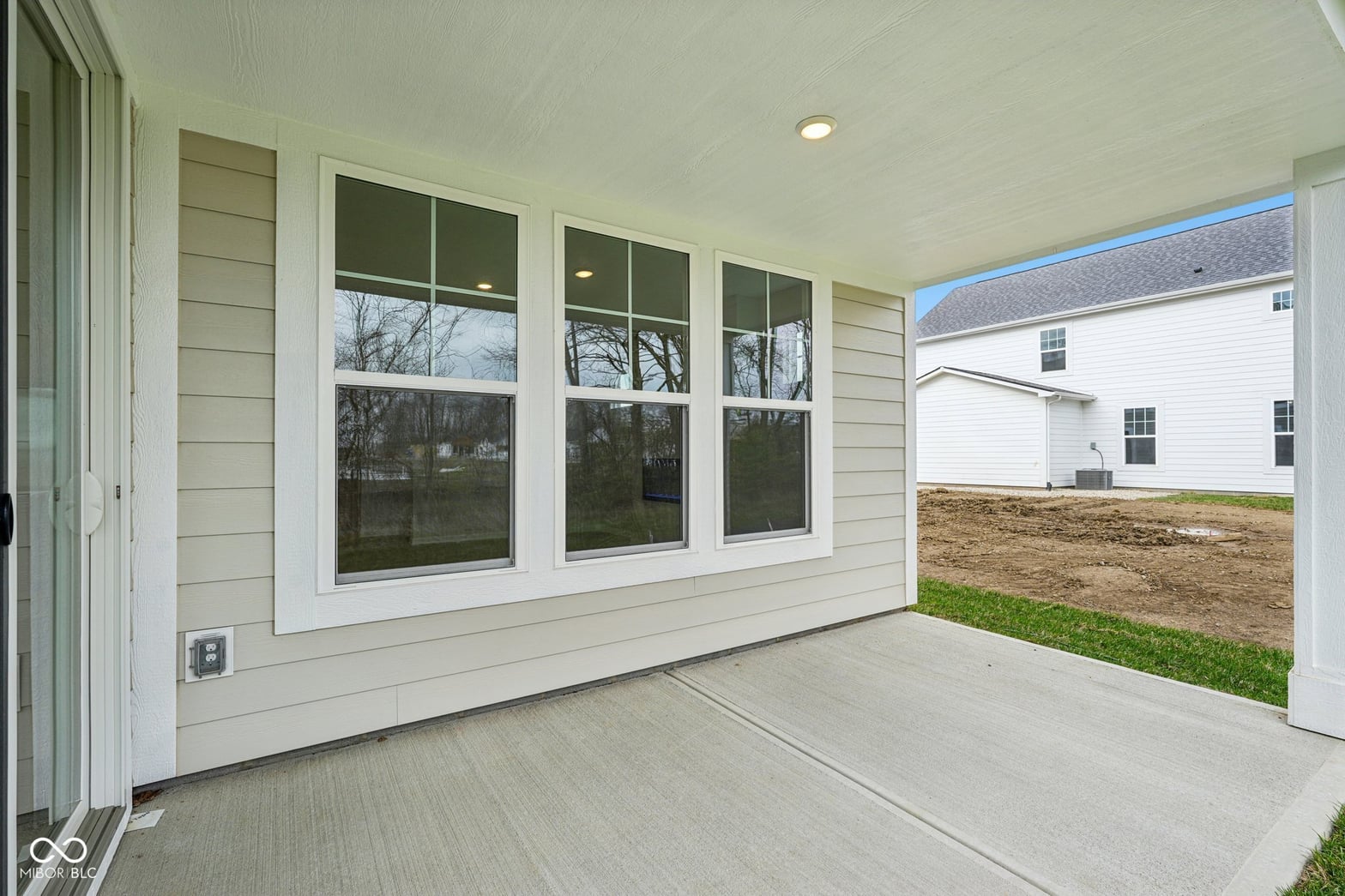 Spacious covered patio with abundant natural light.