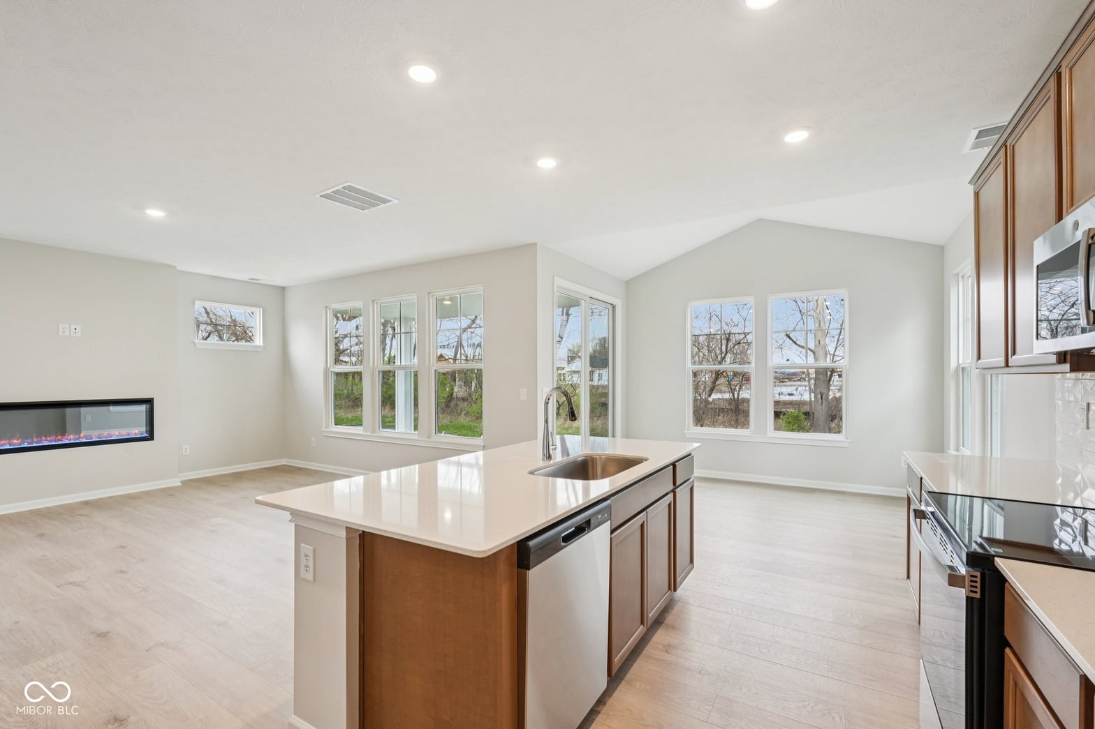 Bright modern kitchen with large island and abundant natural light.