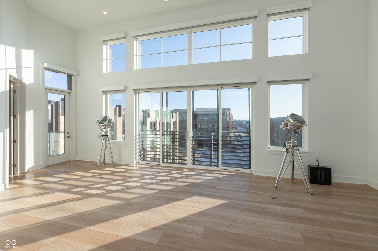 Stunning city views from expansive floor-to-ceiling windows.