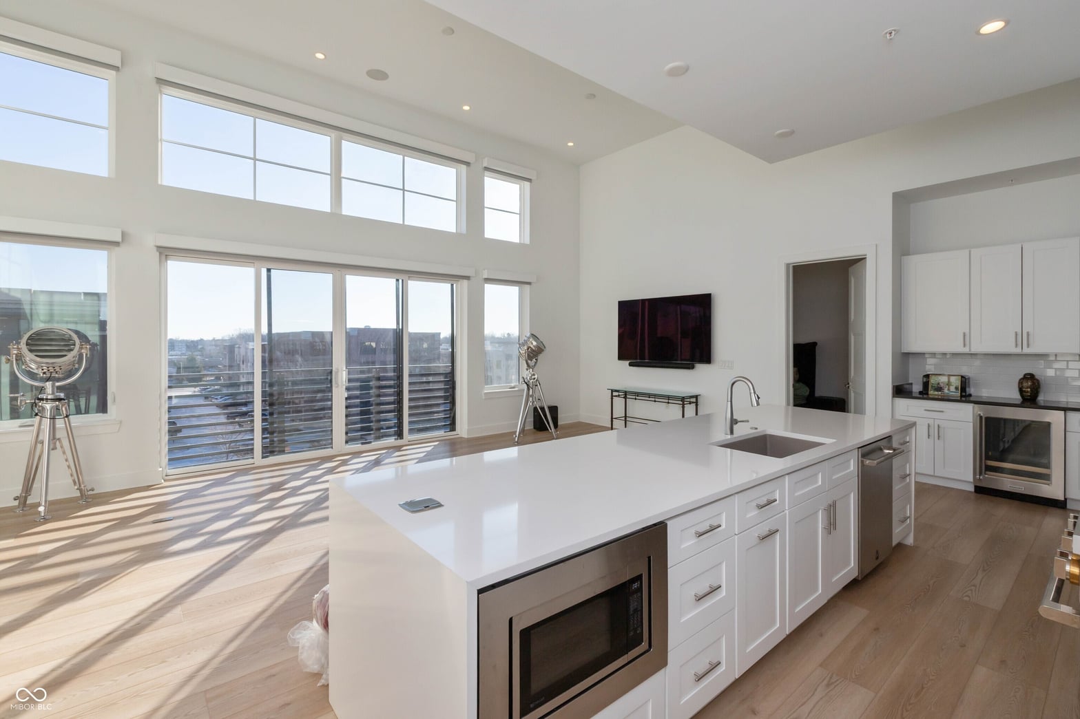 Modern kitchen with panoramic city views and premium finishes.