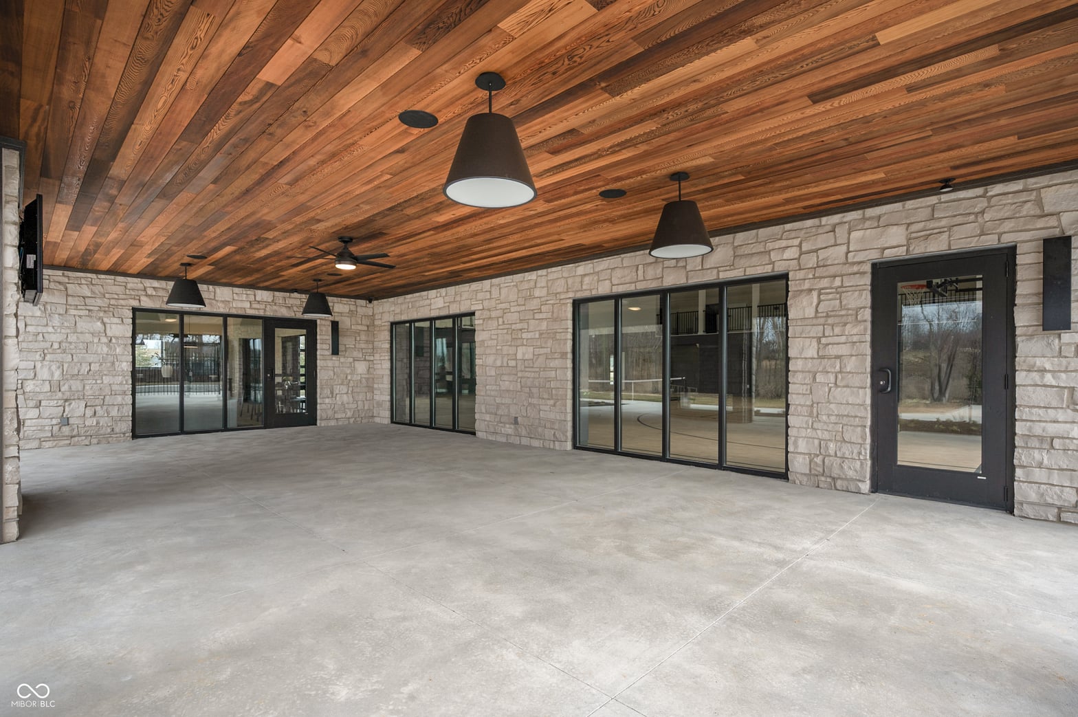 Expansive modern covered patio with premium finishes.
