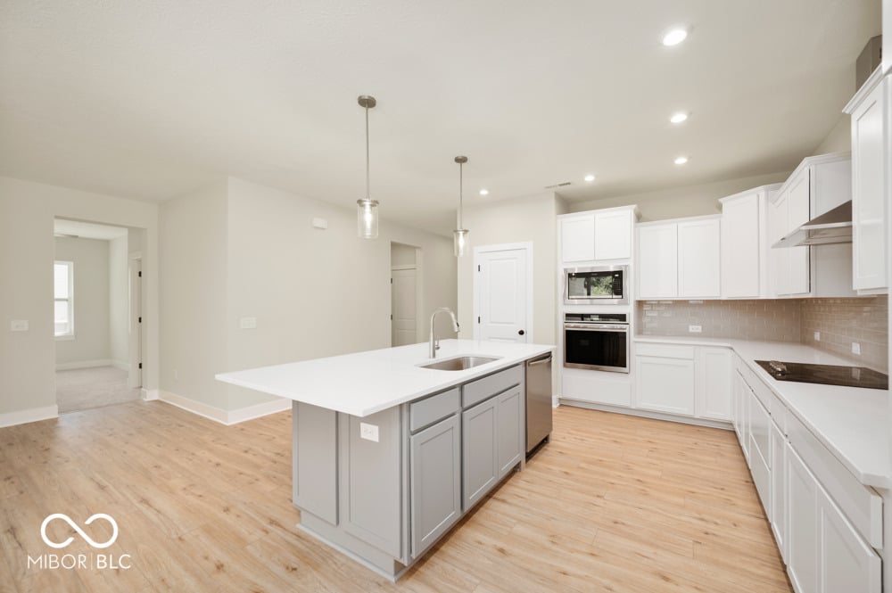 Bright contemporary kitchen with large island and premium finishes.