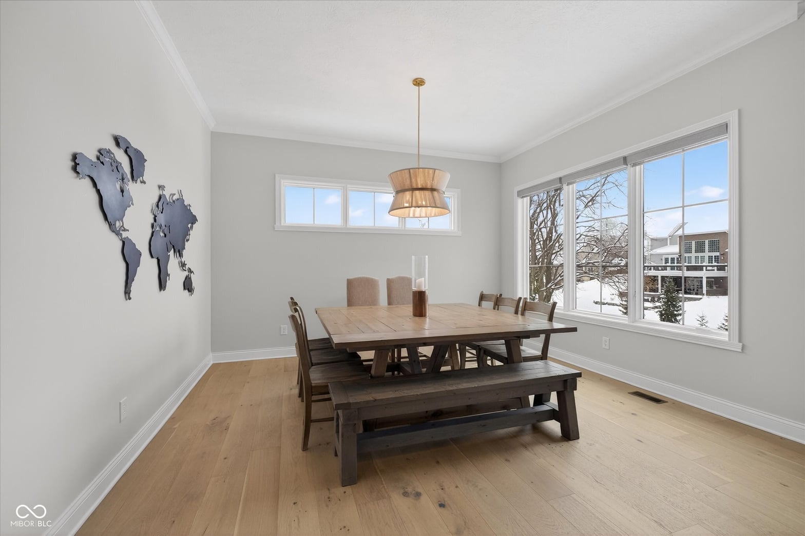 Bright dining room with abundant natural light and views.