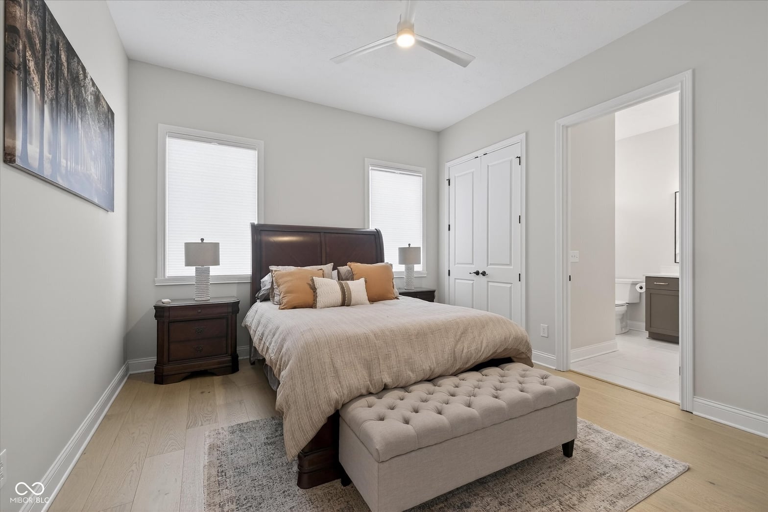 Spacious primary bedroom with ensuite bathroom and walk-in closet.