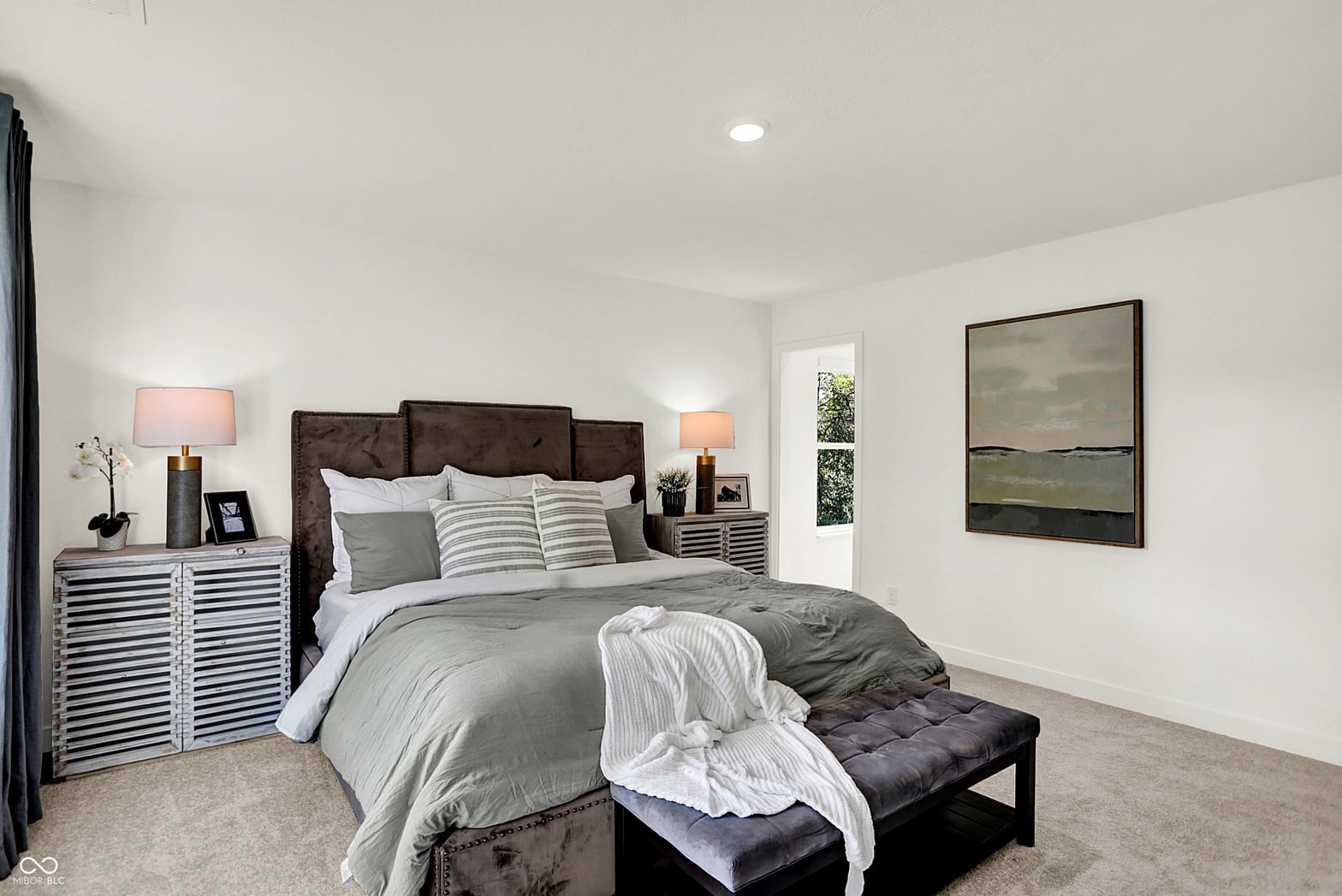 Spacious primary suite with modern finishes and natural light.