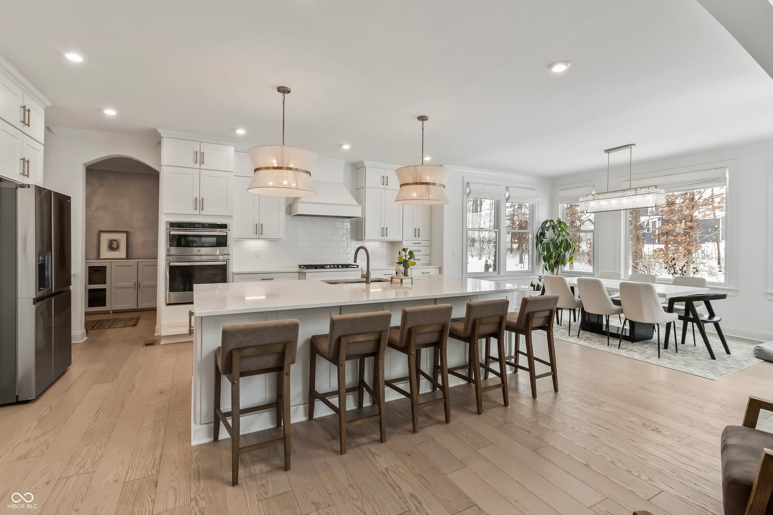 Bright, modern kitchen with island seating and premium appliances.