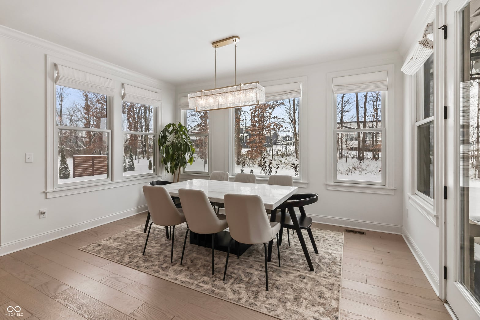 Bright dining room with expansive windows and modern finishes.
