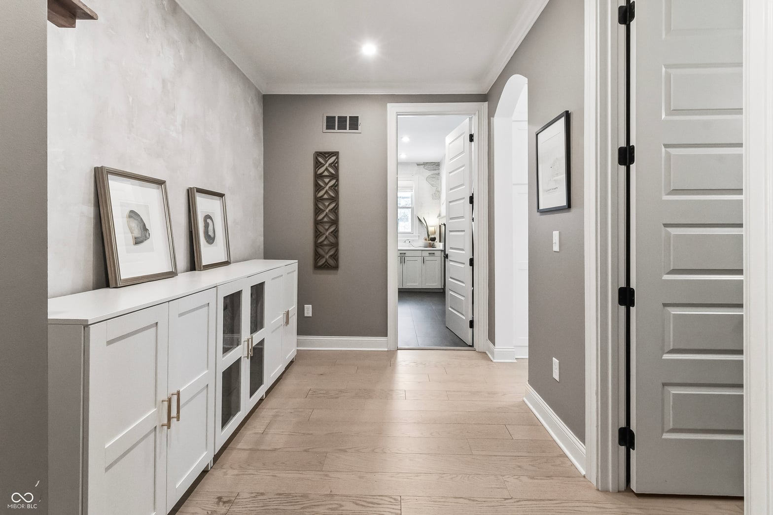 Luxurious primary bath with double vanity and modern finishes.