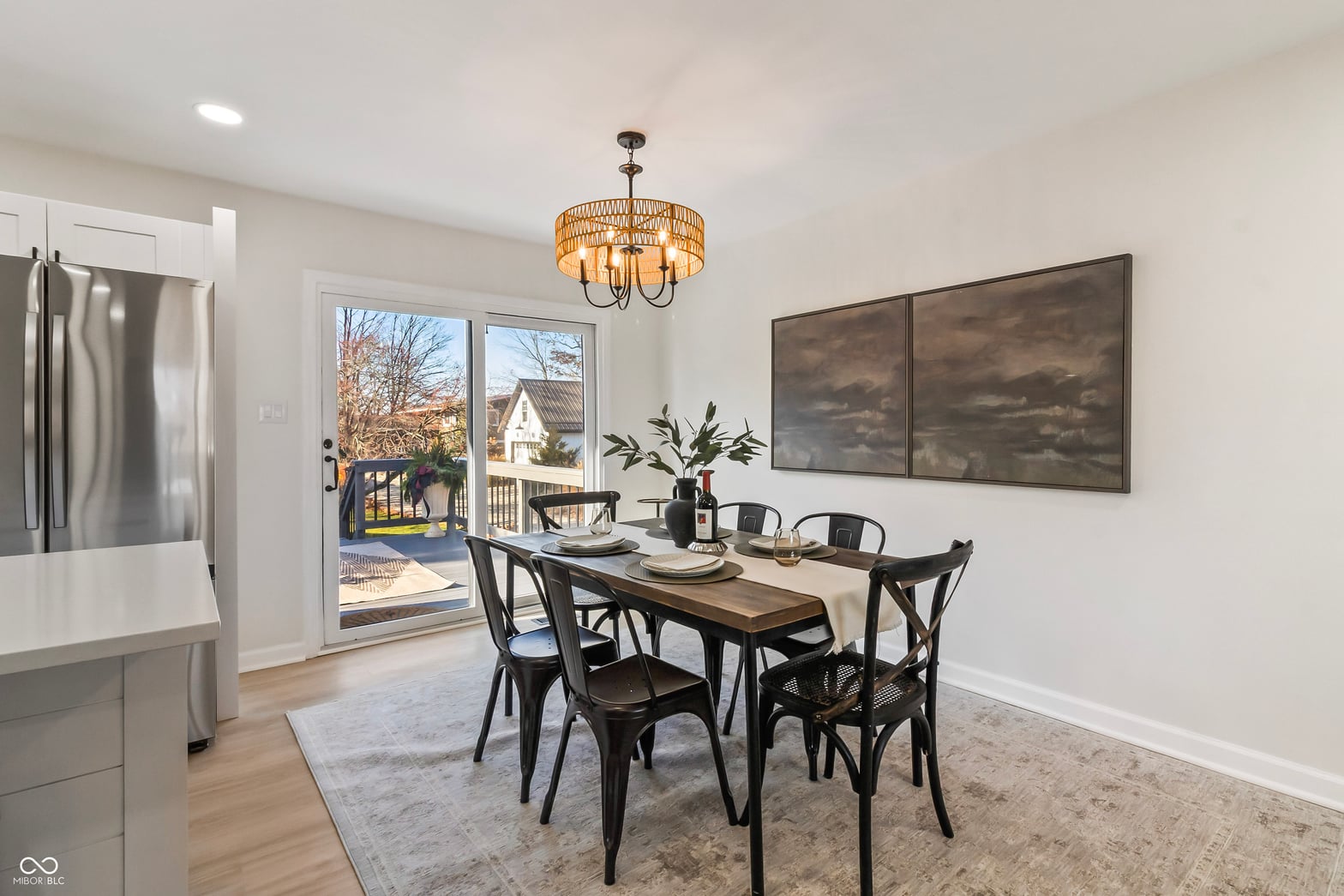 Bright updated dining area with deck access and modern finishes.