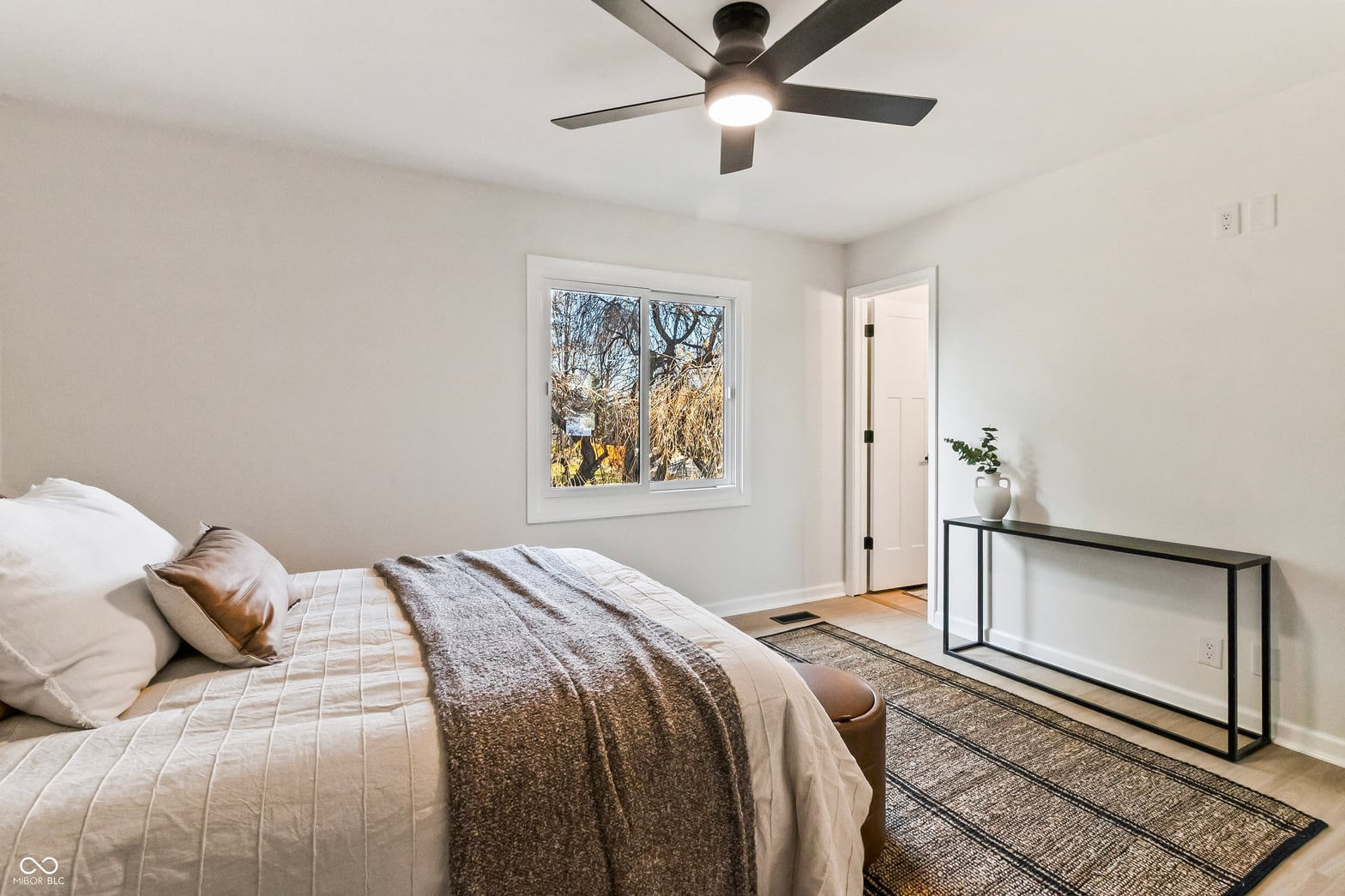Bright, airy primary bedroom with modern finishes