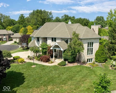 Front exterior at 434 Sheffield Court, Carmel, IN — Stunning updated two-story home with elegant brick exterior.