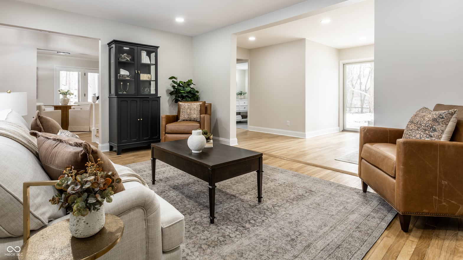 Bright, spacious family room with premium leather furnishings.