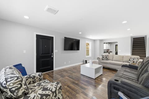 Family room at 15545 Hazel Dell Road, Noblesville, IN — Modern family room with hardwood floors and open layout.