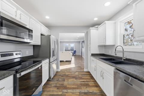 Kitchen at 15545 Hazel Dell Road, Noblesville, IN — Bright, renovated kitchen with premium finishes and flow.