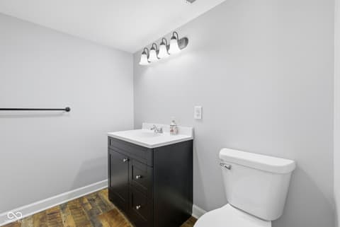 Bathroom at 15545 Hazel Dell Road, Noblesville, IN — Modern updated bathroom with sleek black vanity.