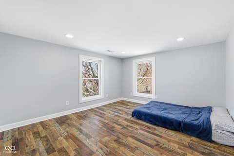 Bedroom at 15545 Hazel Dell Road, Noblesville, IN — Bright, spacious bedroom with beautiful hardwood floors.