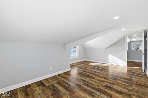 Bonus room at 15545 Hazel Dell Road, Noblesville, IN — Bright bonus room with vaulted ceilings and skylights.
