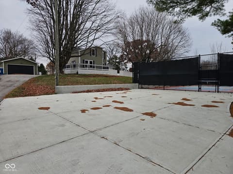 Front exterior at 15545 Hazel Dell Road, Noblesville, IN — Colonial home with tennis court and spacious grounds.