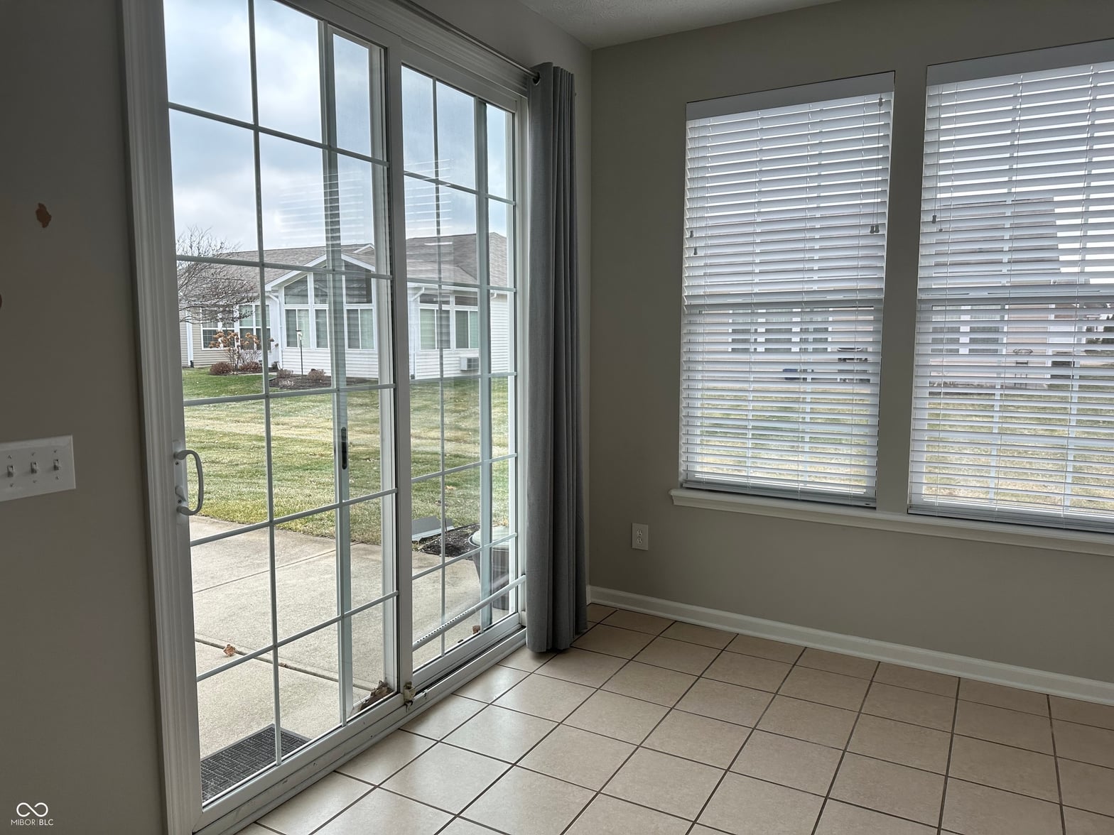 Bright family room with direct backyard access via glass doors.