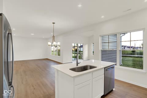 Kitchen at 1353 Mahoning Road, Sheridan, IN — Bright modern kitchen with island and expansive windows.